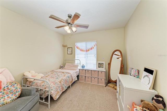 bedroom featuring a ceiling fan and light carpet