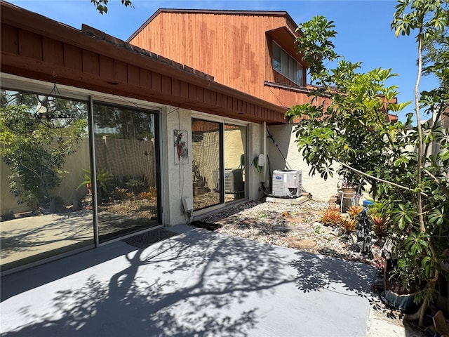 2058 Sunset Point Rd Unit 11, Clearwater, FL 33765 - view of patio / terrace with cooling unit and a cooling unit