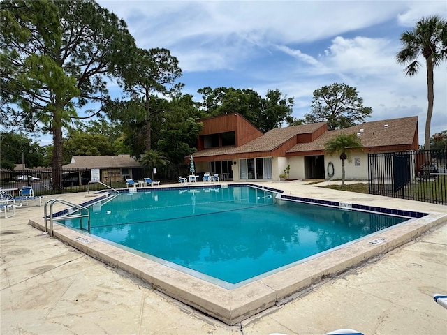 2058 Sunset Point Rd Unit 11, Clearwater, FL 33765 - community pool featuring a patio
