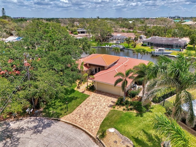 birds eye view of property with a water view
