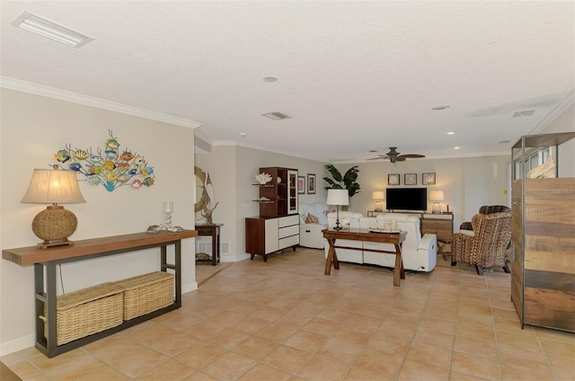 living area with crown molding, visible vents, and ceiling fan