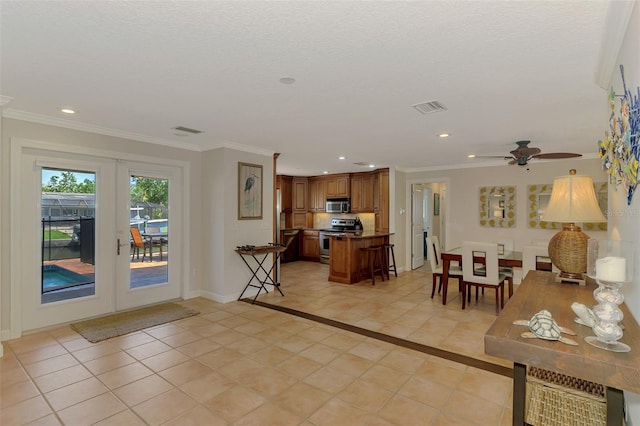interior space featuring visible vents, french doors, ceiling fan, and recessed lighting