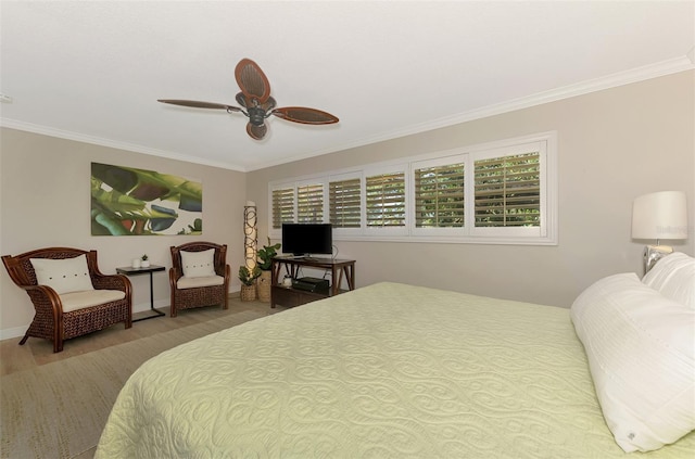 bedroom with baseboards, ceiling fan, and crown molding