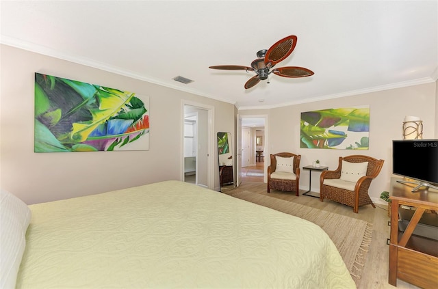 bedroom with crown molding, light wood-type flooring, visible vents, and ceiling fan