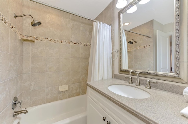 full bathroom featuring vanity and shower / bath combo with shower curtain