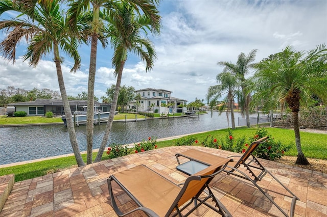 view of patio / terrace featuring a water view and a residential view