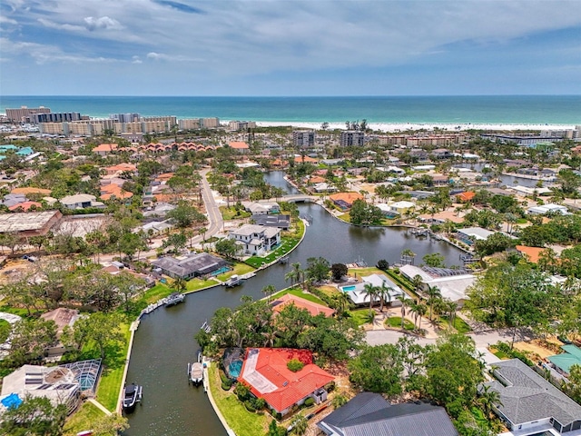 birds eye view of property featuring a water view and a residential view