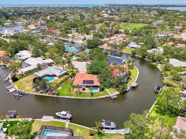 drone / aerial view with a water view and a residential view