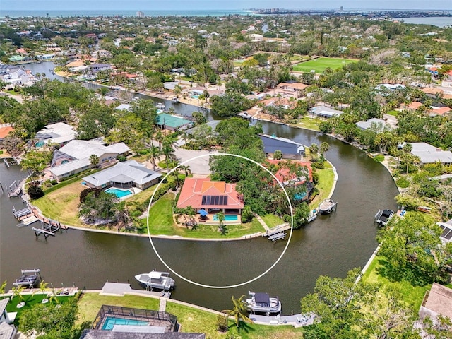 birds eye view of property with a water view and a residential view
