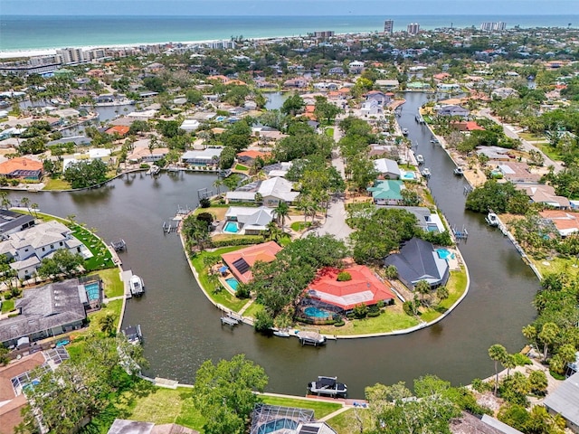 birds eye view of property featuring a water view and a residential view