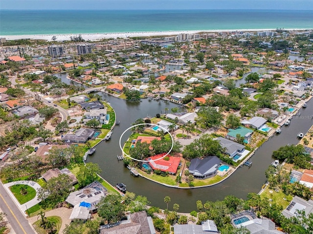 bird's eye view featuring a water view and a residential view