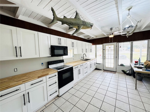 kitchen with range with electric stovetop, wooden counters, a sink, black microwave, and beam ceiling