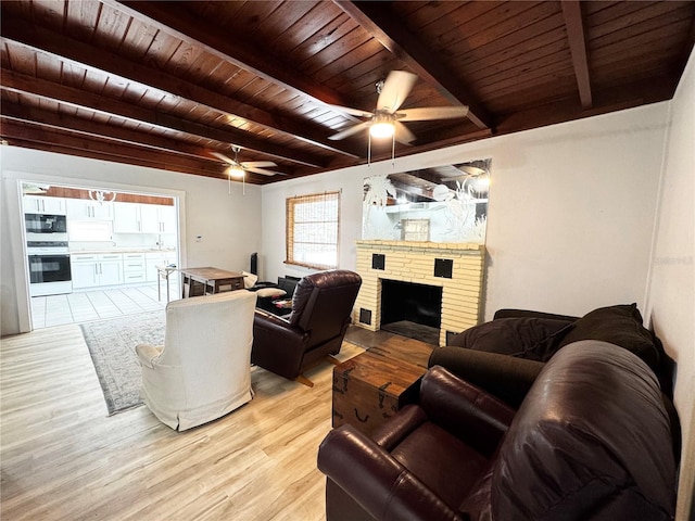 living room with wooden ceiling, beam ceiling, ceiling fan, and light wood-style floors