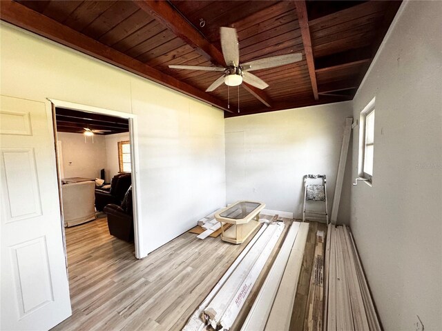 interior space featuring beamed ceiling and plenty of natural light