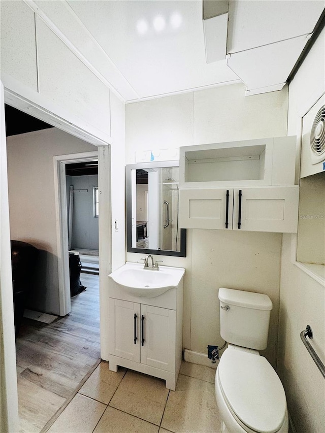 bathroom featuring tile patterned floors, toilet, and vanity