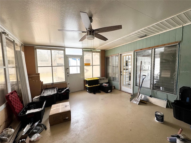 sunroom / solarium with ceiling fan