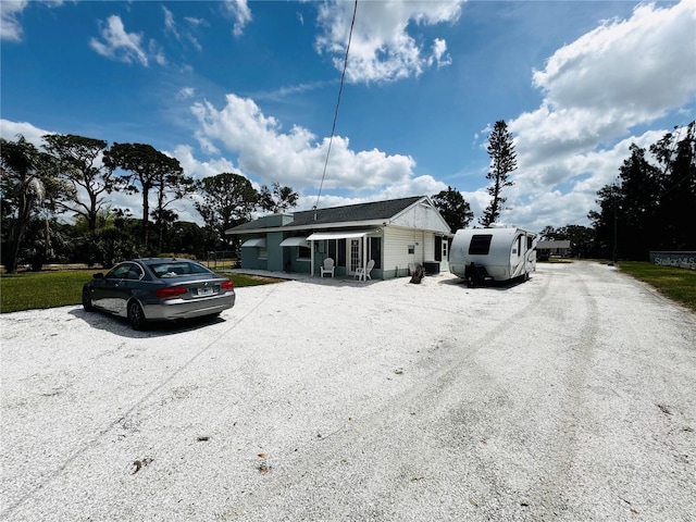 ranch-style house with gravel driveway