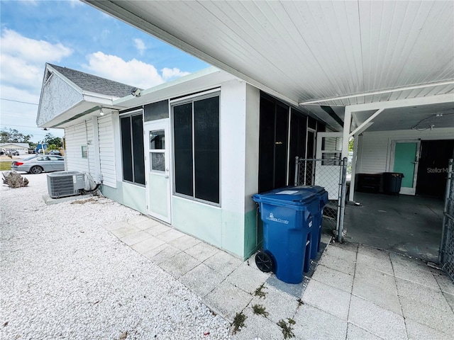 view of side of property featuring central AC unit