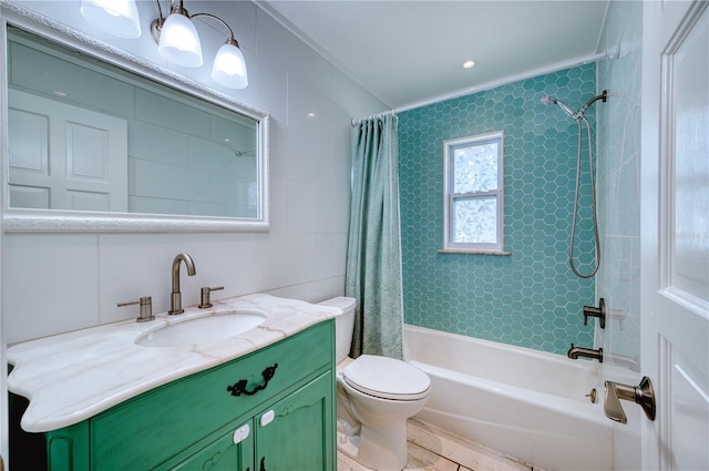 full bathroom featuring toilet, tile walls, shower / bath combo, and vanity