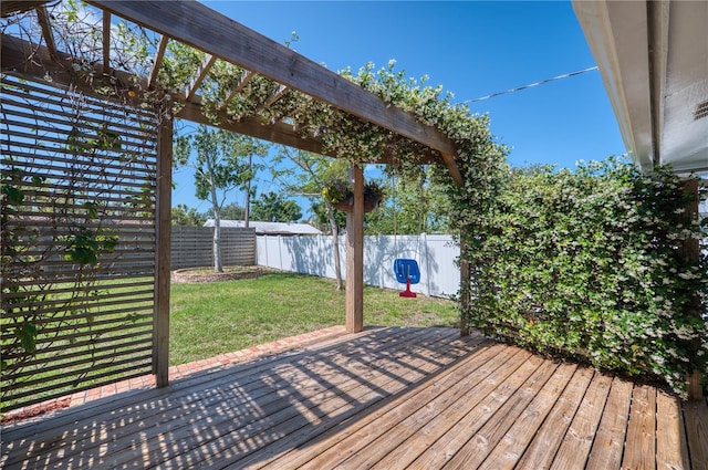 deck with a fenced backyard, a yard, and a pergola