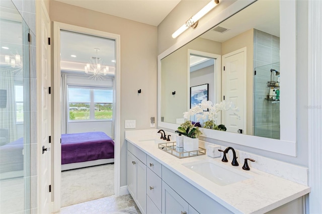 full bath with double vanity, visible vents, a tile shower, and a sink
