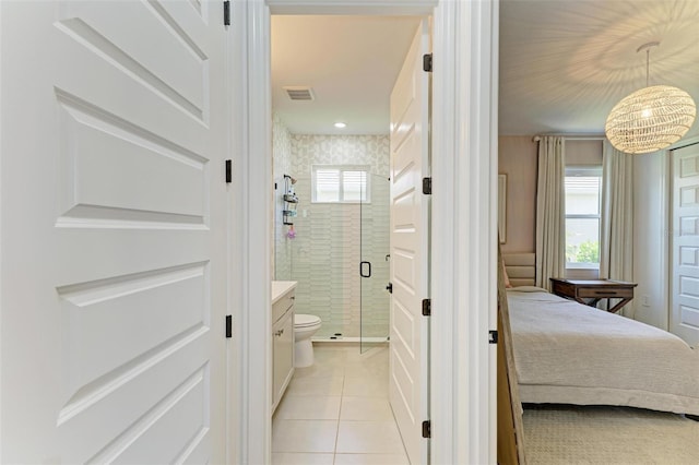 full bath with visible vents, a stall shower, vanity, tile patterned floors, and ensuite bathroom