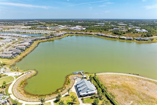 birds eye view of property with a water view and a residential view
