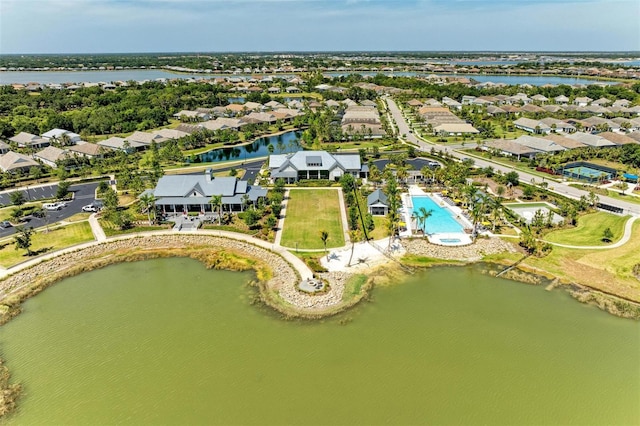 bird's eye view featuring a water view and a residential view