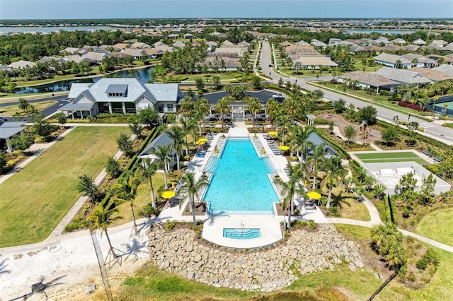 aerial view with a water view and a residential view