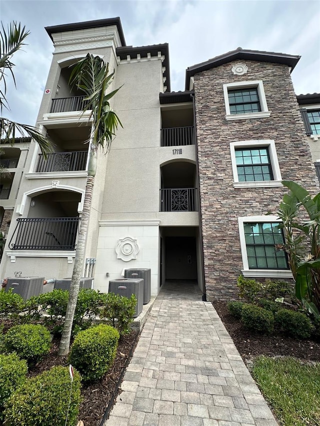view of building exterior featuring central AC unit