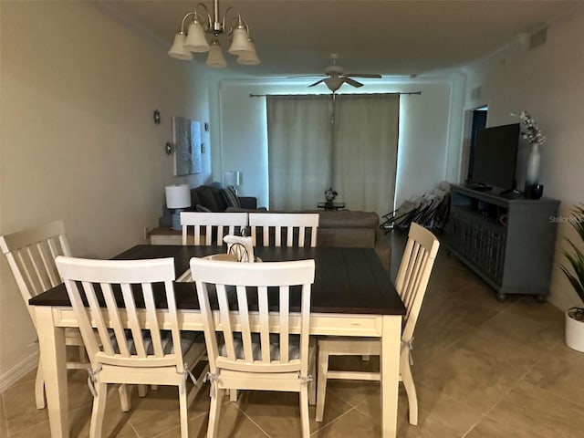 dining room with tile patterned floors and ceiling fan with notable chandelier