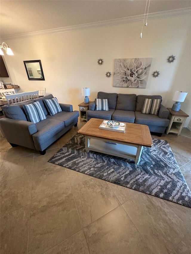 living area featuring tile patterned flooring and ornamental molding