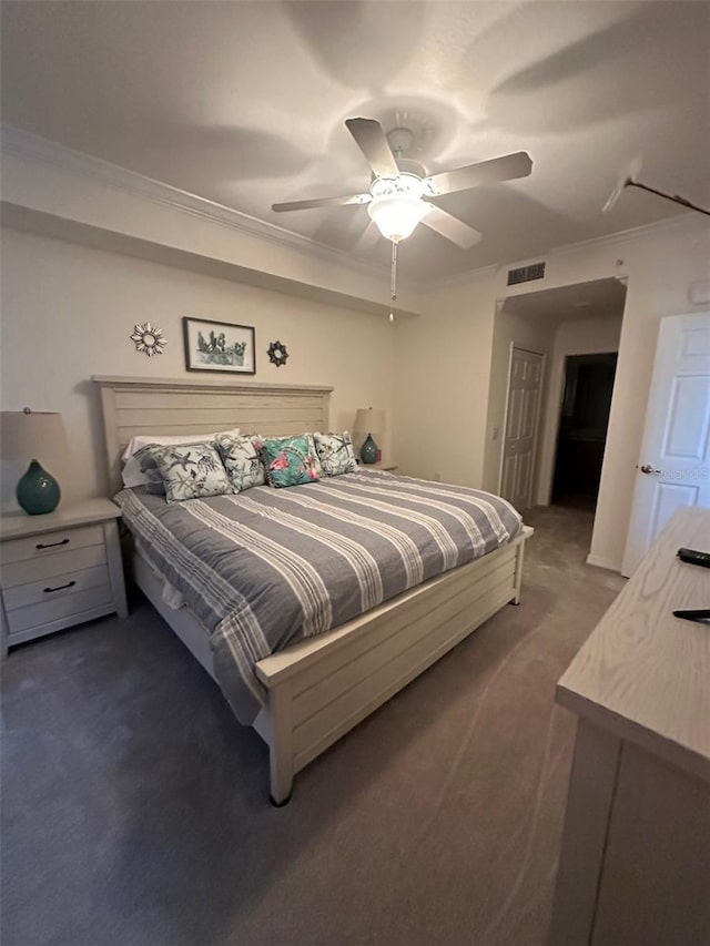 bedroom featuring crown molding, a ceiling fan, dark carpet, and visible vents