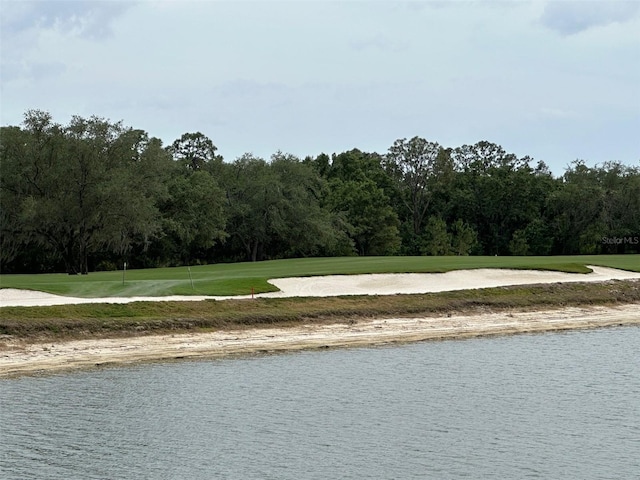 property view of water featuring view of golf course