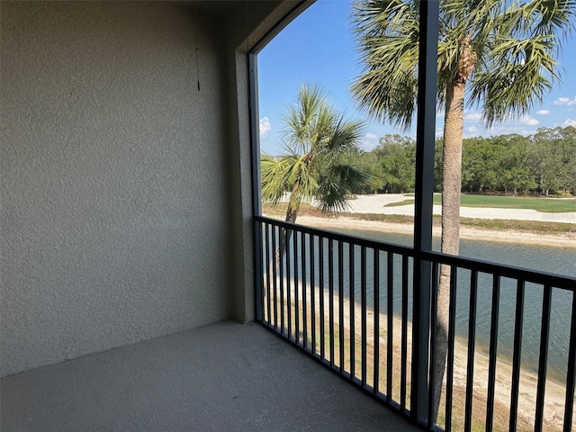 balcony featuring a water view