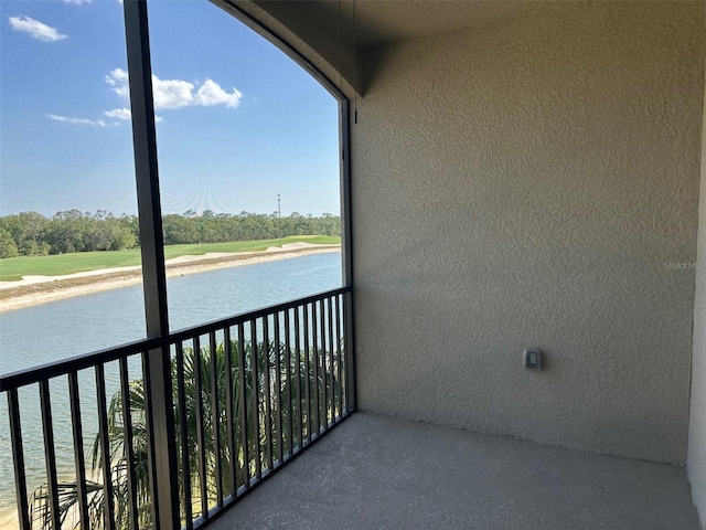 balcony featuring a water view