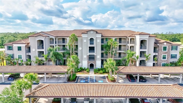 17118 Vardon Ter Unit 304, Bradenton, FL 34211 - view of building exterior with covered and uncovered parking