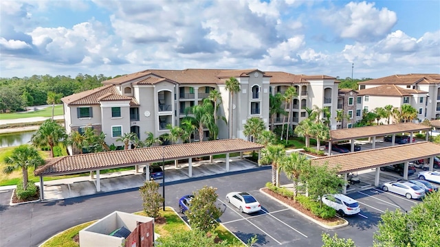 17118 Vardon Ter Unit 304, Bradenton, FL 34211 - view of building exterior featuring covered and uncovered parking and a water view