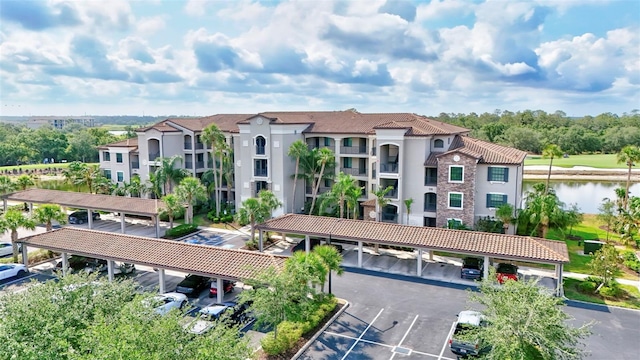 17118 Vardon Ter Unit 304, Bradenton, FL 34211 - view of building exterior featuring covered and uncovered parking and a water view