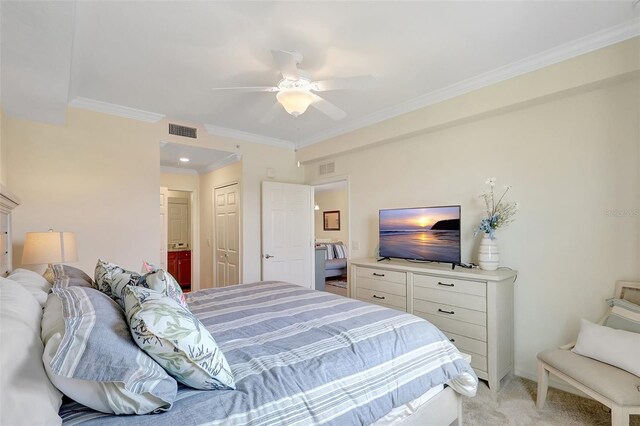 17118 Vardon Ter Unit 304, Bradenton, FL 34211 - bedroom with ornamental molding, ensuite bathroom, light carpet, a closet, and ceiling fan