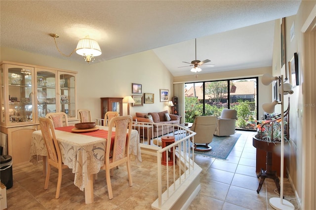 5362 Huntingwood Ct Unit 16, Sarasota, FL 34235 - dining area featuring a ceiling fan, a textured ceiling, light tile patterned floors, and lofted ceiling