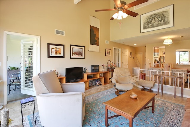 5362 Huntingwood Ct Unit 16, Sarasota, FL 34235 - living area featuring tile patterned flooring, a high ceiling, a ceiling fan, and visible vents