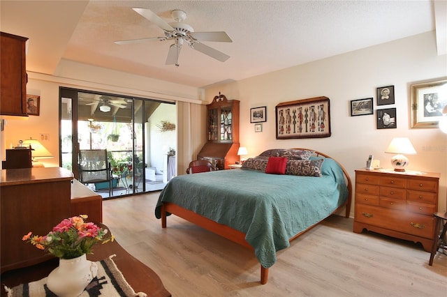 5362 Huntingwood Ct Unit 16, Sarasota, FL 34235 - bedroom with ceiling fan, access to exterior, and light wood finished floors