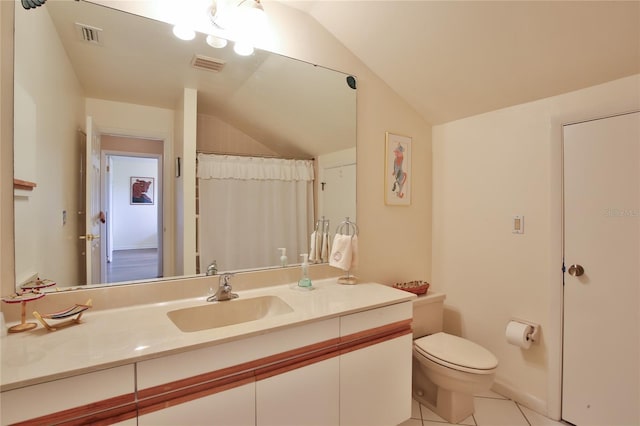 5362 Huntingwood Ct Unit 16, Sarasota, FL 34235 - bathroom with tile patterned flooring, vanity, toilet, vaulted ceiling, and visible vents