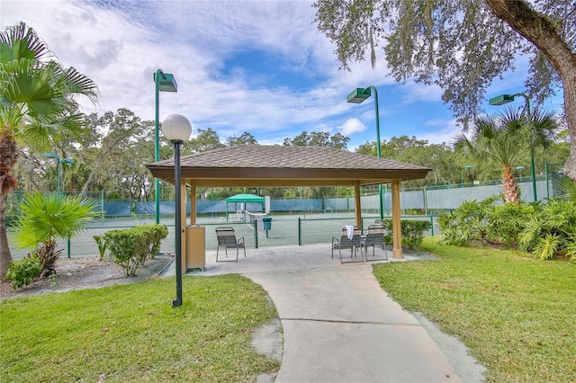 5362 Huntingwood Ct Unit 16, Sarasota, FL 34235 - view of home's community featuring fence, a gazebo, a tennis court, and a yard