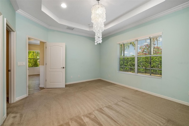 11634 Piedmont Park Xing, Bradenton, FL 34211 - carpeted spare room with a tray ceiling, a chandelier, crown molding, baseboards, and recessed lighting