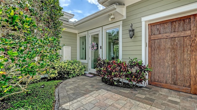 property entrance featuring an attached garage