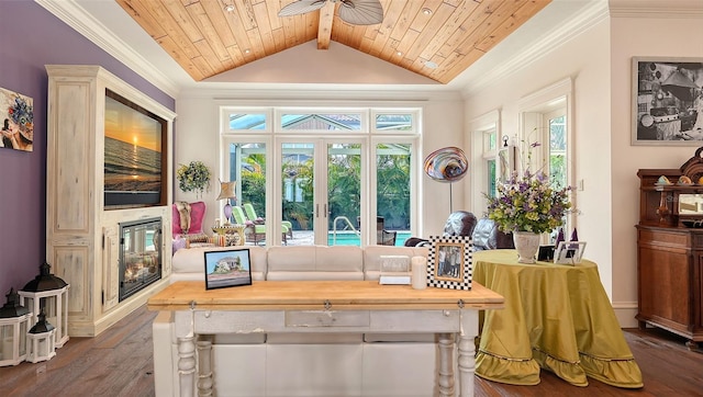 sitting room featuring dark wood-style flooring, a ceiling fan, wood ceiling, a multi sided fireplace, and crown molding