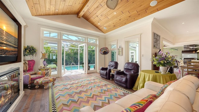 living area with wood-type flooring, a glass covered fireplace, recessed lighting, and wooden ceiling