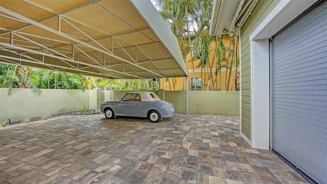view of parking / parking lot with fence